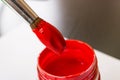 Brush for red paint and can closeup Royalty Free Stock Photo