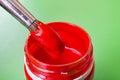 Brush for red paint and can closeup Royalty Free Stock Photo