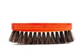 Brush with red wooden handle for cleaning clothes or shoes isolated on a white background Royalty Free Stock Photo