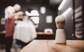 Brush for shaving beard along, blurred background of hair salon for men, barber shop Royalty Free Stock Photo