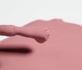 Brush and spilled pink nail polish, macro Royalty Free Stock Photo