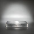 Brushed aluminum rectangular block with horizontal texture lines on dark surface metal Royalty Free Stock Photo