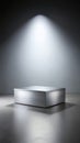 Brushed aluminum rectangular display podium with horizontal texture lines under spotlight horizontal lines Royalty Free Stock Photo