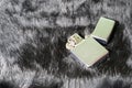 Brushed chrome lighter with windproof on black fur. Amazing quality and durability. Royalty Free Stock Photo