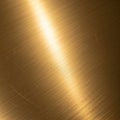 Brushed gold metal surface with a subtle linear texture. The light reflects evenly across the Royalty Free Stock Photo