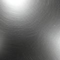 Brushed metal surface with circular patterns, exhibiting a smooth texture and Royalty Free Stock Photo