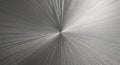 Brushed metal surface with a circular, radial pattern emanating from a central point. The texture Royalty Free Stock Photo
