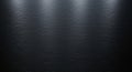 Brushed metal surface with a dark tone and subtle horizontal texture. Sof Royalty Free Stock Photo