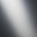Brushed metal surface displaying a smooth texture with fine linear patterns running Royalty Free Stock Photo