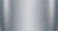 A brushed metal surface with a horizontal texture, exhibiting a smooth, reflective Royalty Free Stock Photo