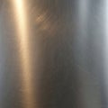 Brushed metal surface with a smooth texture and subtle horizontal lines Royalty Free Stock Photo