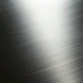 Brushed metal surface with a subtle grain texture running horizontally, creating a sleek Royalty Free Stock Photo