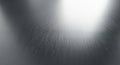 Brushed metal surface with a subtle, linear grain texture. The light reflects gently across the Royalty Free Stock Photo