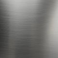 Brushed metal texture with fine linear patterns running horizontally across a smooth Royalty Free Stock Photo