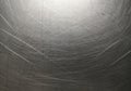 Brushed metallic surface with numerous intersecting scratches, creating a textured Royalty Free Stock Photo