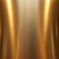 Brushed metallic surface with a warm golden hue, featuring fine, linear scratches and reflections. Royalty Free Stock Photo