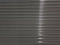 Stainless Steel background with a streak of light Royalty Free Stock Photo