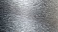 Close-up view of brushed stainless steel surface showcasing intricate textures and reflections in natural light Royalty Free Stock Photo