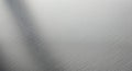 Brushed stainless steel surface with a fine, linear texture. The pattern consists of subtle, Royalty Free Stock Photo