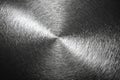 Brushed steel surface forming a circular pattern with a bright reflection Royalty Free Stock Photo