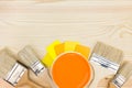 Brushes, color guide and paint can on wooden background Royalty Free Stock Photo