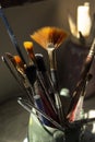 brushes of different size and thickness inside a ceramic container on a table Royalty Free Stock Photo