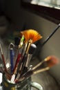 brushes of different size and thickness inside a ceramic container on a table Royalty Free Stock Photo