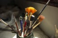brushes of different size and thickness inside a ceramic container on a table Royalty Free Stock Photo