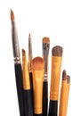 Brushes for applying makeup on lips and eyes close-up on white isolated background