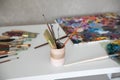 brushes for drawing white oist palette with paints art Royalty Free Stock Photo