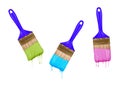 Brushes of dripping colored paint