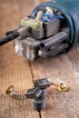 Brushes for electric motor on a workbench. Spare parts for angle grinders Royalty Free Stock Photo