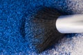 Brushes for make-up on the blue  eye shadow glitter. close up Royalty Free Stock Photo