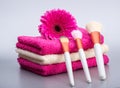 Brushes for make-up on towel with big pink flower Royalty Free Stock Photo