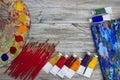 Brushes, paint, palette on wood background Royalty Free Stock Photo