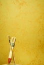 Brushes on a painted wall background. Decorative plaster. Abstract ornament Royalty Free Stock Photo