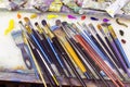 Brushes for painting and colored oil paints lie on palette in the artist`s studio Royalty Free Stock Photo