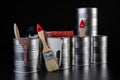 Brushes for painting with paint and cans on a workshop table. Painting accessories prepared for painting Royalty Free Stock Photo