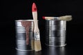 Brushes for painting with paint and cans on a workshop table. Painting accessories prepared for painting Royalty Free Stock Photo