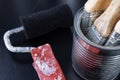 Brushes for painting with paint and cans on a workshop table. Painting accessories prepared for painting Royalty Free Stock Photo