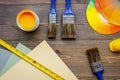 Brushes, paunts and palette on wooden table background top view