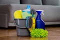 Brushes, sponges, rubber gloves and cleaners in the cleaning bucket. Household cleaners Royalty Free Stock Photo