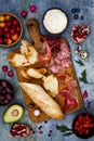 Brushetta or authentic traditional spanish tapas set for lunch table. Sharing antipasti on party picnic time on blue background Royalty Free Stock Photo