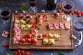 Brushetta or authentic traditional spanish tapas set for lunch table. Sharing antipasti on party or summer picnic time Royalty Free Stock Photo