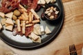 Brushetta set for wine. Variety of small sandwiches with prosciutto, tomatoes, parmesan cheese, fresh basil and balsamic Royalty Free Stock Photo