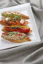 Brushetta snacks for wine. Variety of small sandwiches on a textile background