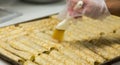 Brushing Butter on Cannolis