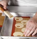 Brushing Butter on Pastry Royalty Free Stock Photo