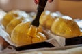 Brushing the cakes with egg yolk