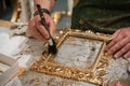 Brushing a frame during the gilding process tecnique